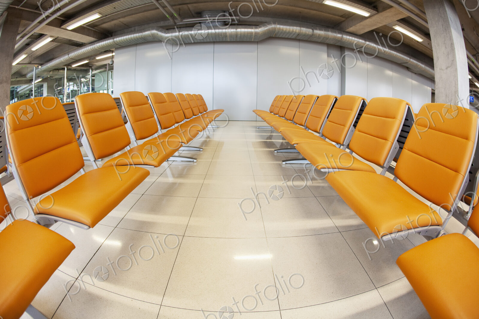 Seats in waiting area at airport.