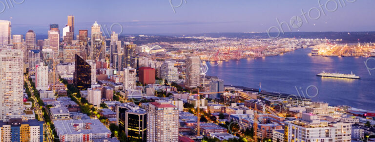 Seattle cityscape and coastline at dusk
