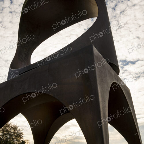 Seattle skyline and the Space Needle seen through the Changing Form sculpture by… Seattle skyline and the Space Needle seen through the Changing Form sculpture by…