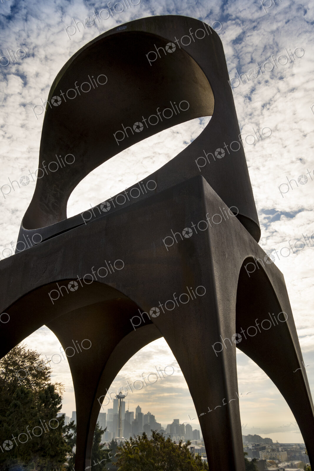 Seattle skyline and the Space Needle seen through the Changing Form sculpture by…
