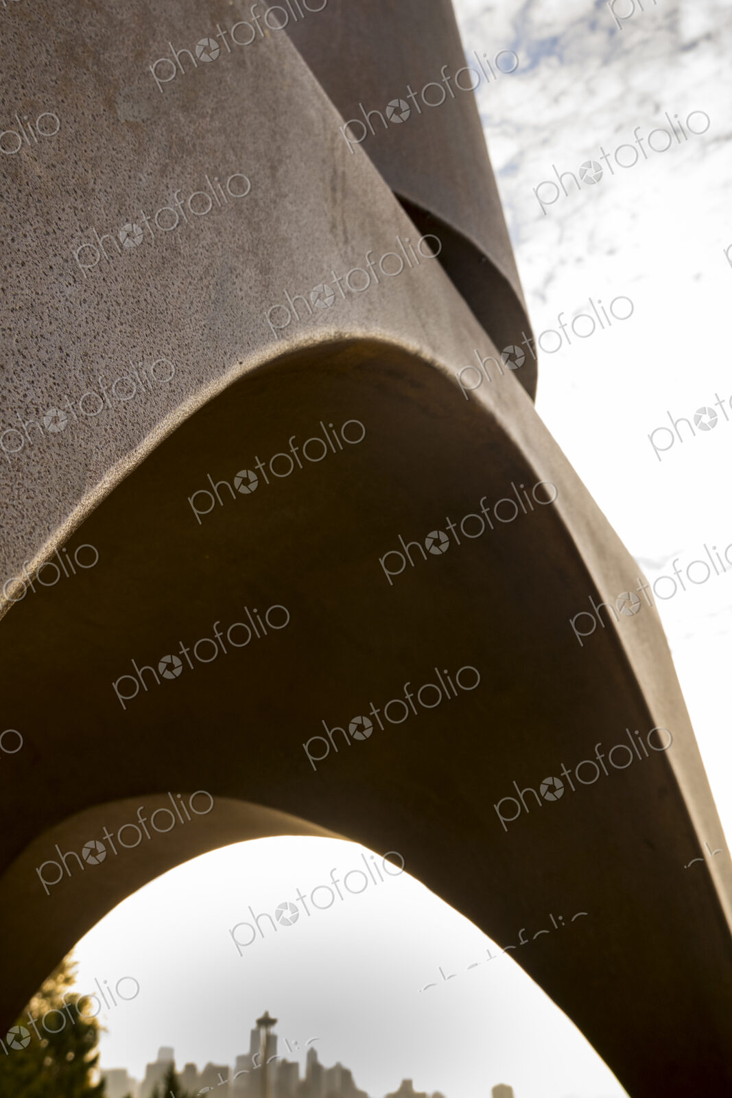 Seattle skyline and the Space Needle seen through the Changing Form sculpture by…
