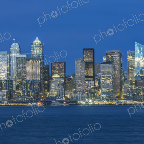 Seattle skyline, from Puget Sound, downtown buildings at night.