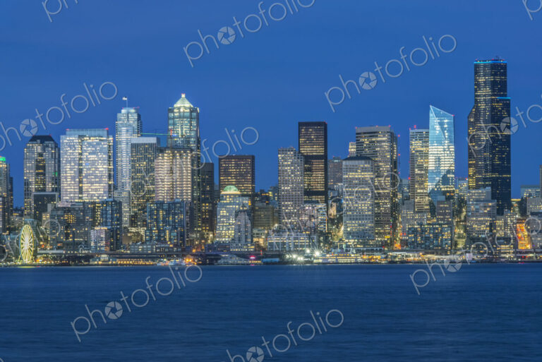 Seattle skyline, from Puget Sound, downtown buildings at night.