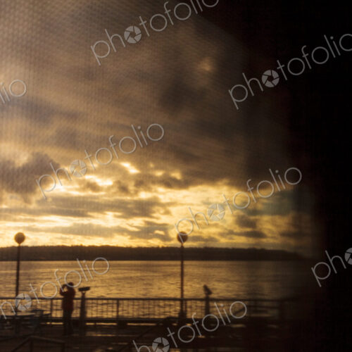 Seattle waterfront view through window shade, WA USA Seattle waterfront view through window shade, WA USA
