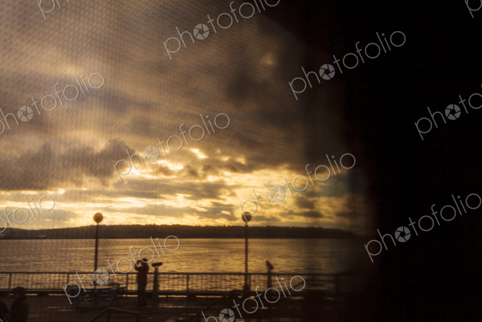 Seattle waterfront view through window shade, WA USA