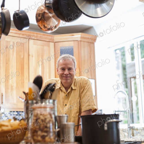 Senior man working in a home kitchen,