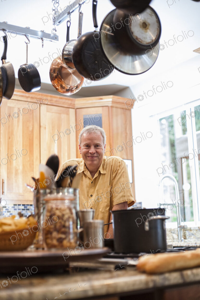 Senior man working in a home kitchen,