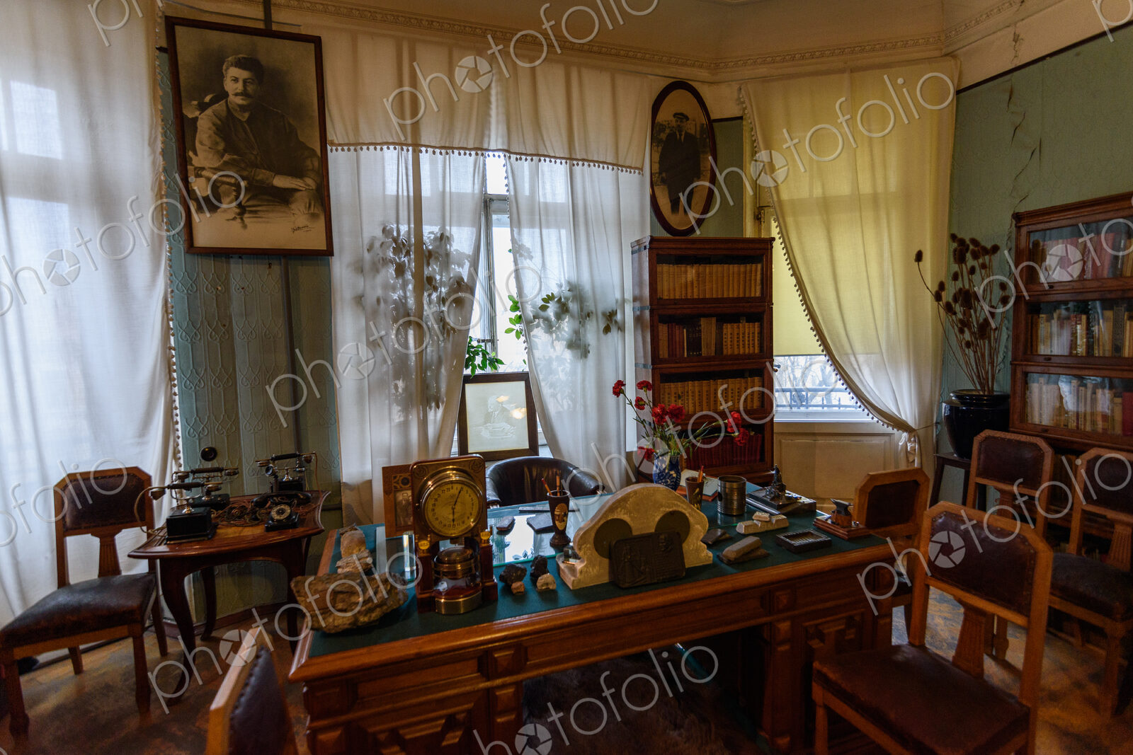 Sergey Kirov Apartment-Museum, a room with a writing desk and portraits of Stalin and…