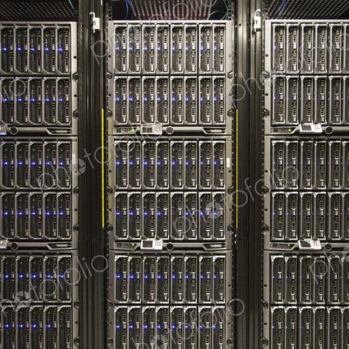 Servers on racks in a large computere server farm. Servers on racks in a large computere server farm.