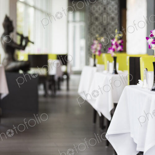 Set tables in Thai restaurant Set tables in Thai restaurant