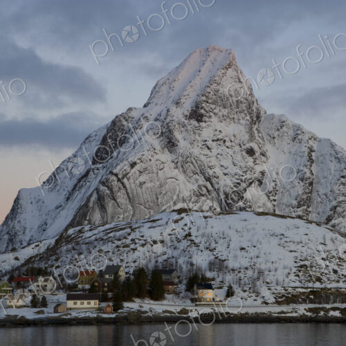 Settlement on a shore, with snow-capped mountains behind. Settlement on a shore, with snow-capped mountains behind.