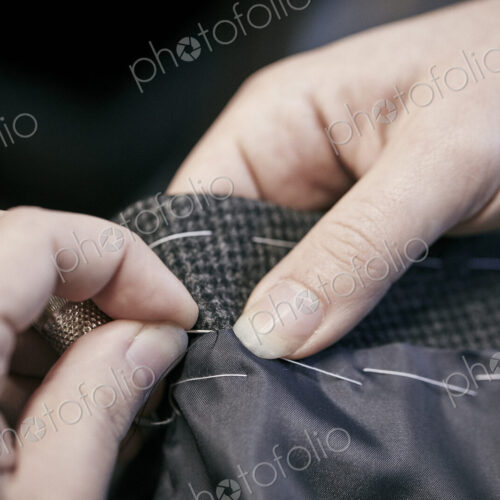Sewing by hand using needle and thread Sewing by hand using needle and thread