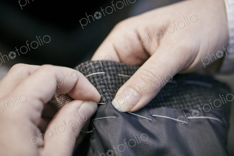 Sewing by hand using needle and thread