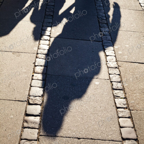 Shadows of family on sidewalk, Denmark Shadows of family on sidewalk, Denmark
