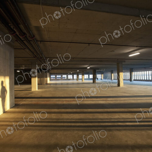 Shadows of two men shaking hands on the wall of an empty raw business space. Shadows of two men shaking hands on the wall of an empty raw business space.