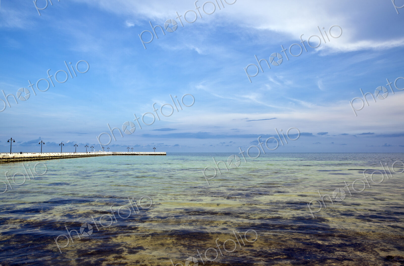 Shallow Coastal Waters under a Blue Sky
