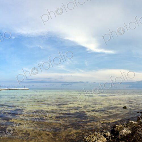 Shallow Coastal Waters under a Blue Sky Shallow Coastal Waters under a Blue Sky