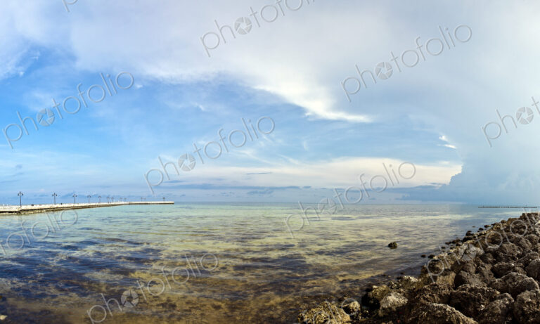 Shallow Coastal Waters under a Blue Sky