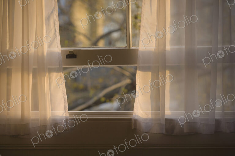 Sheer curtains in open window