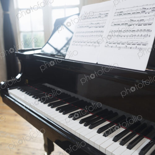 Sheet music on a Grand Piano in a rehearsal studio. Sheet music on a Grand Piano in a rehearsal studio.