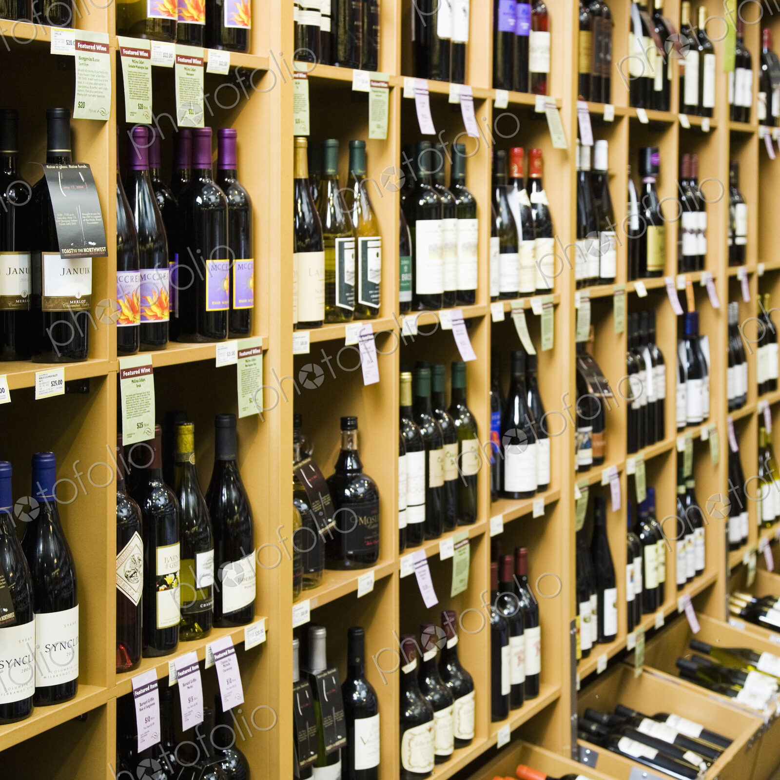 Shelves with bottles of wine in store.