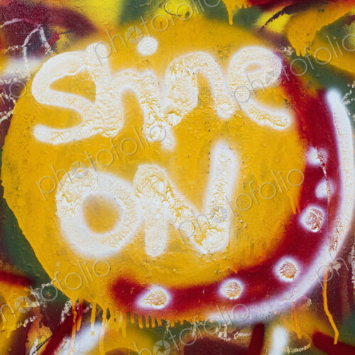 "Shine On" spray painted on wall, close up. "Shine On" spray painted on wall, close up.