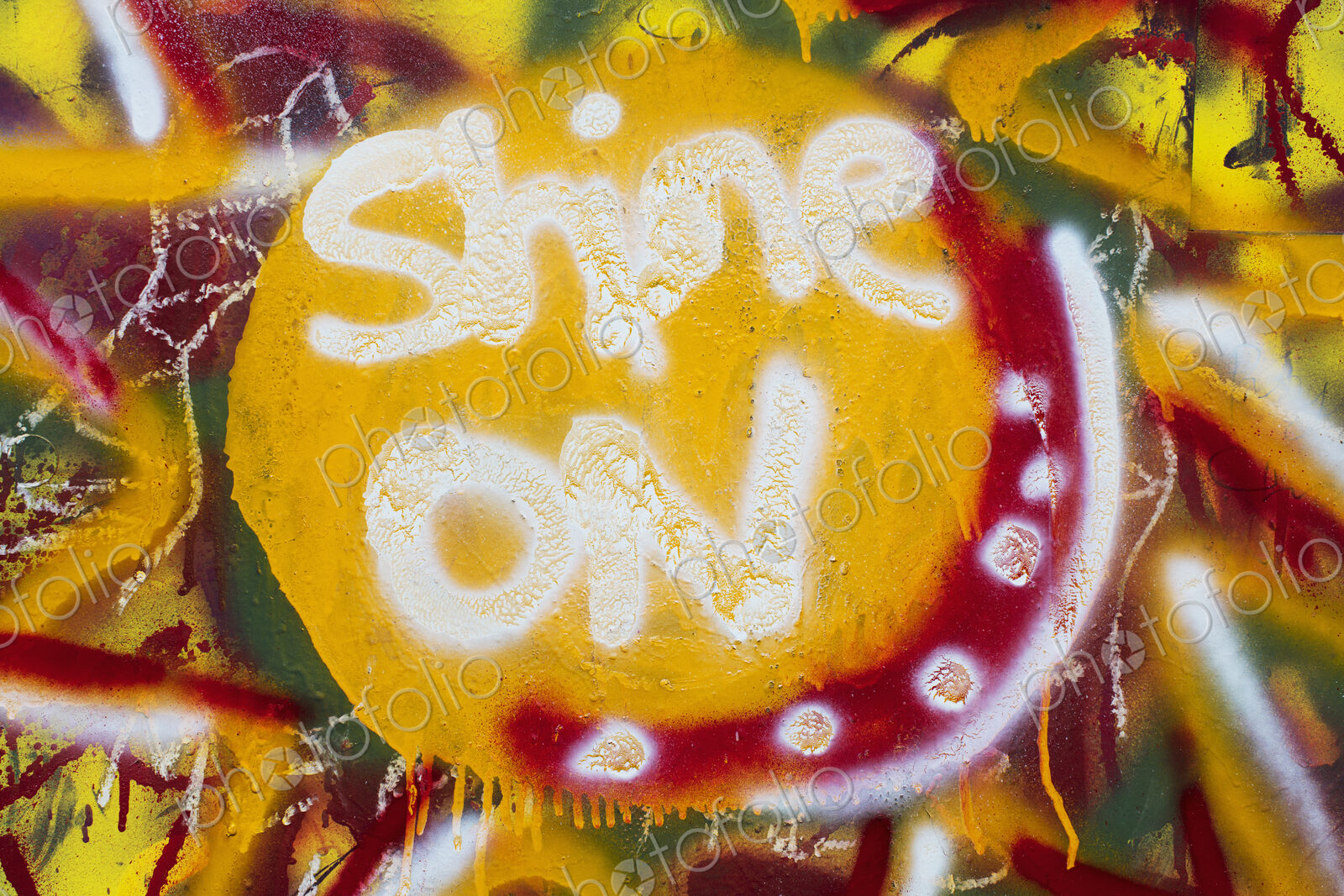 “Shine On” spray painted on wall, close up.
