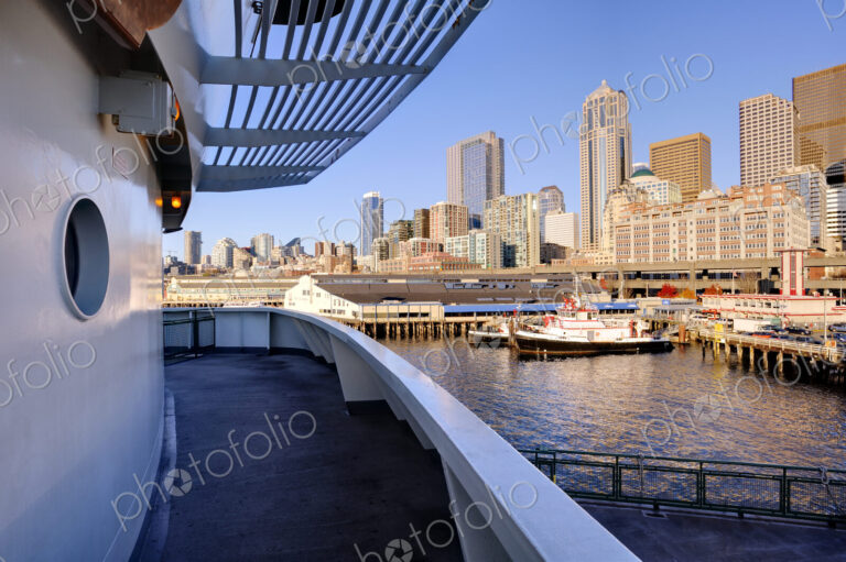 Ship deck in Seattle harbor overlooking cityscape, Washington, United States