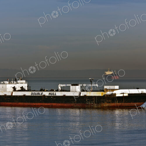 Shipping Vessel Floating in Water Shipping Vessel Floating in Water