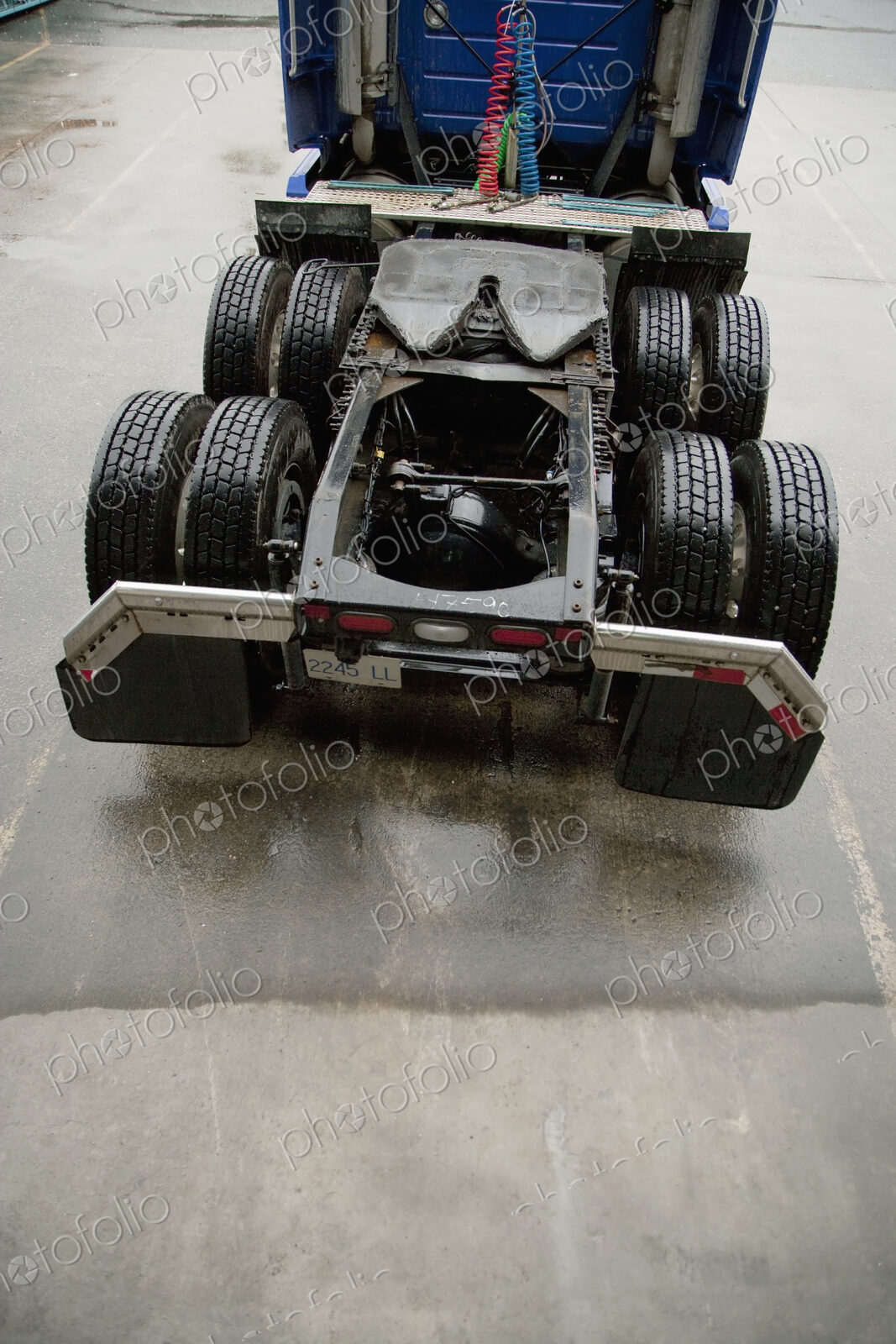 Shipping lorry bed with tyres and no load.