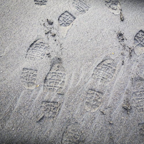 Shoe prints on beach sand, WA USA