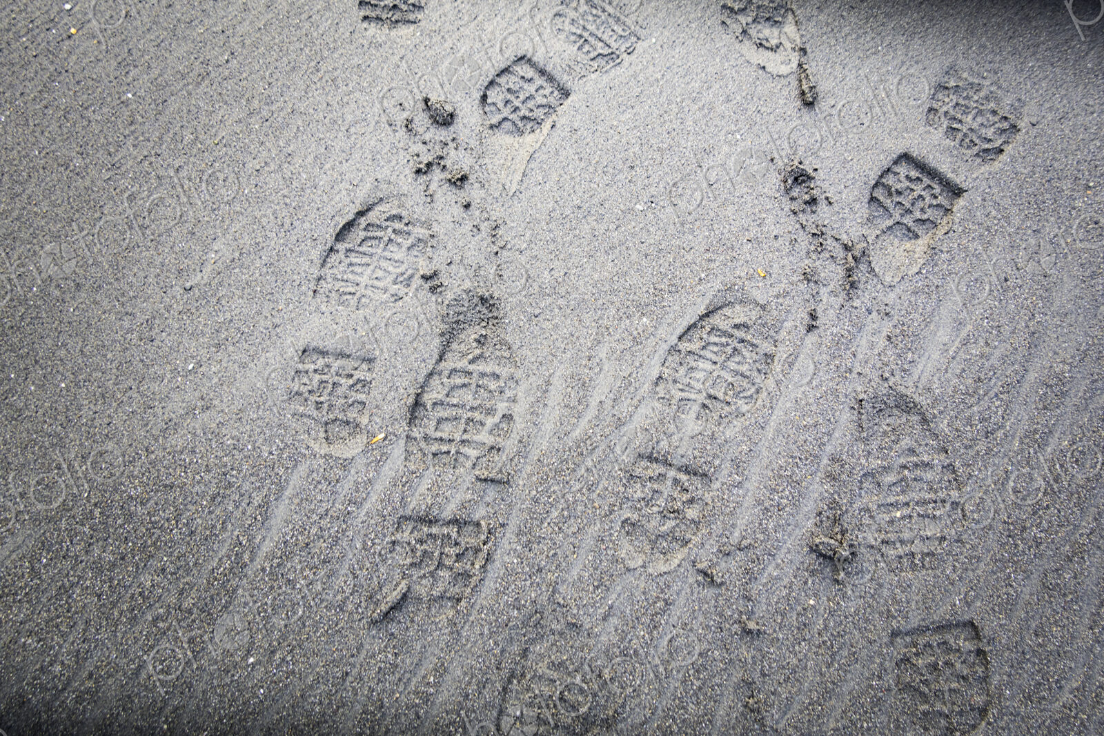 Shoe prints on beach sand, WA USA