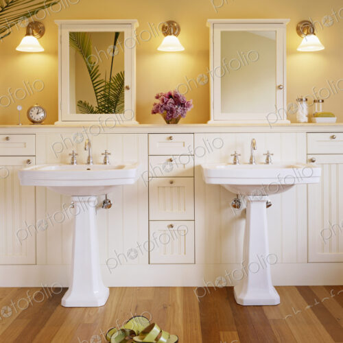 Shoes and pedestal sinks in luxury bathroom Shoes and pedestal sinks in luxury bathroom