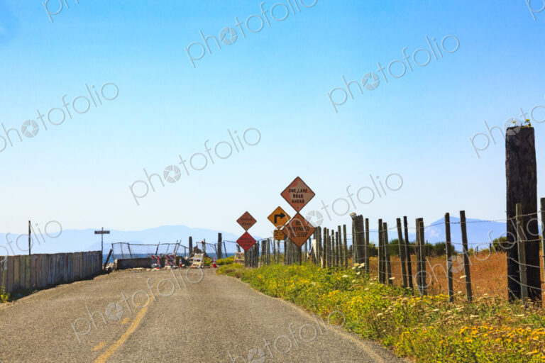 Shoreline erosion, damage to a coastal road on Lummi Island, rubble and broken fences…