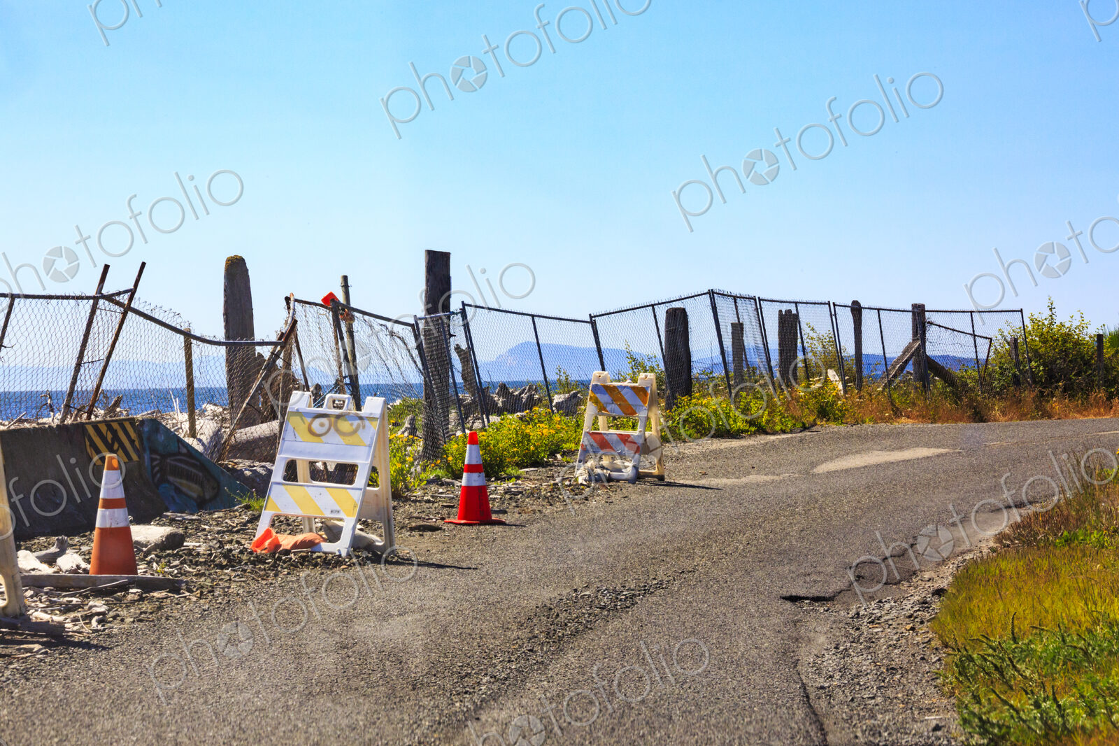 Shoreline erosion, damage to a coastal road on Lummi Island, rubble and broken fences…