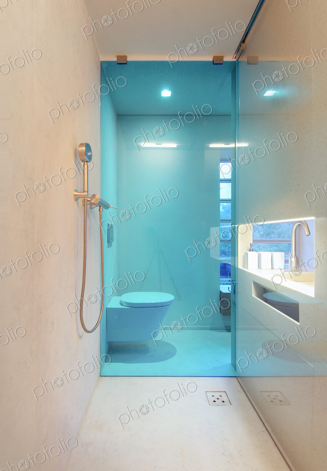 Shower with glass wall in modern bathroom