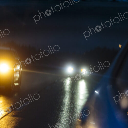 Side mirror reflection, a journey in stormy wet weather in the dark on Interstate 90. Side mirror reflection, a journey in stormy wet weather in the dark on Interstate 90.