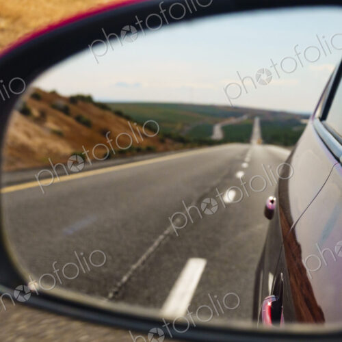Side mirror reflection of remote highway, Interstate 90, WA USA Side mirror reflection of remote highway, Interstate 90, WA USA