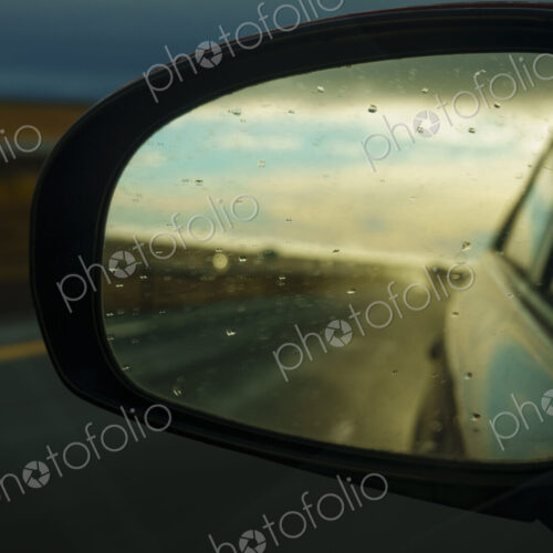 Side mirror reflection of semi-truck on Interstate 90, WA, USA Side mirror reflection of semi-truck on Interstate 90, WA, USA