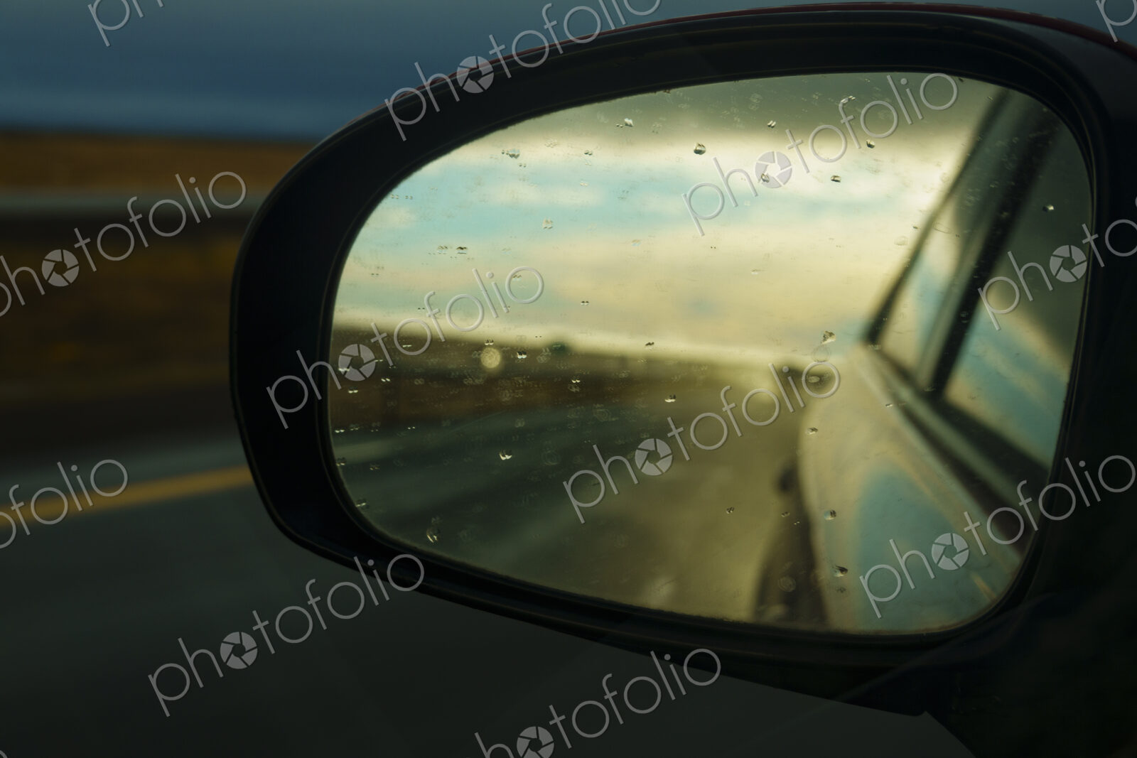 Side mirror reflection of semi-truck on Interstate 90, WA, USA