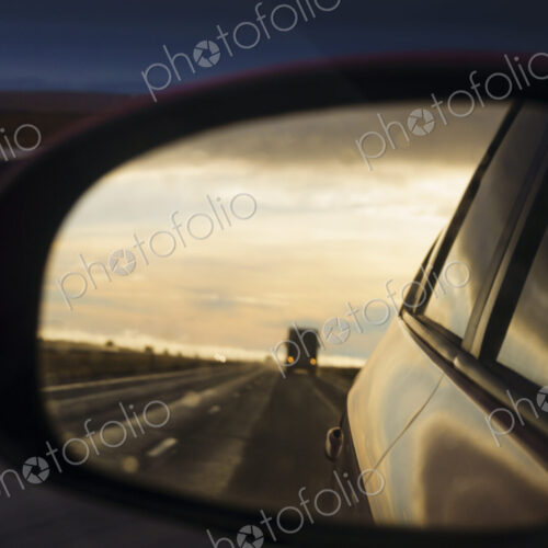 Side mirror reflection of semi-truck on Interstate 90, WA, USA Side mirror reflection of semi-truck on Interstate 90, WA, USA