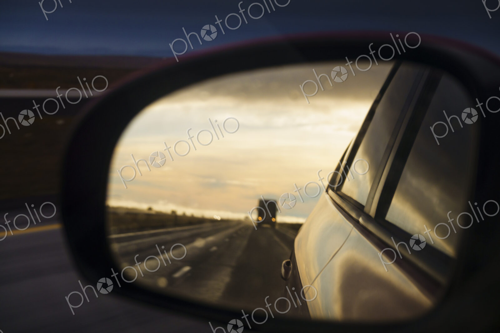 Side mirror reflection of semi-truck on Interstate 90, WA, USA