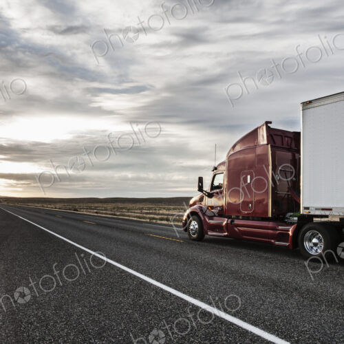 Side view of the cab of a commercial truck on the highway in eastern Washington, USA. Side view of the cab of a commercial truck on the highway in eastern Washington, USA.