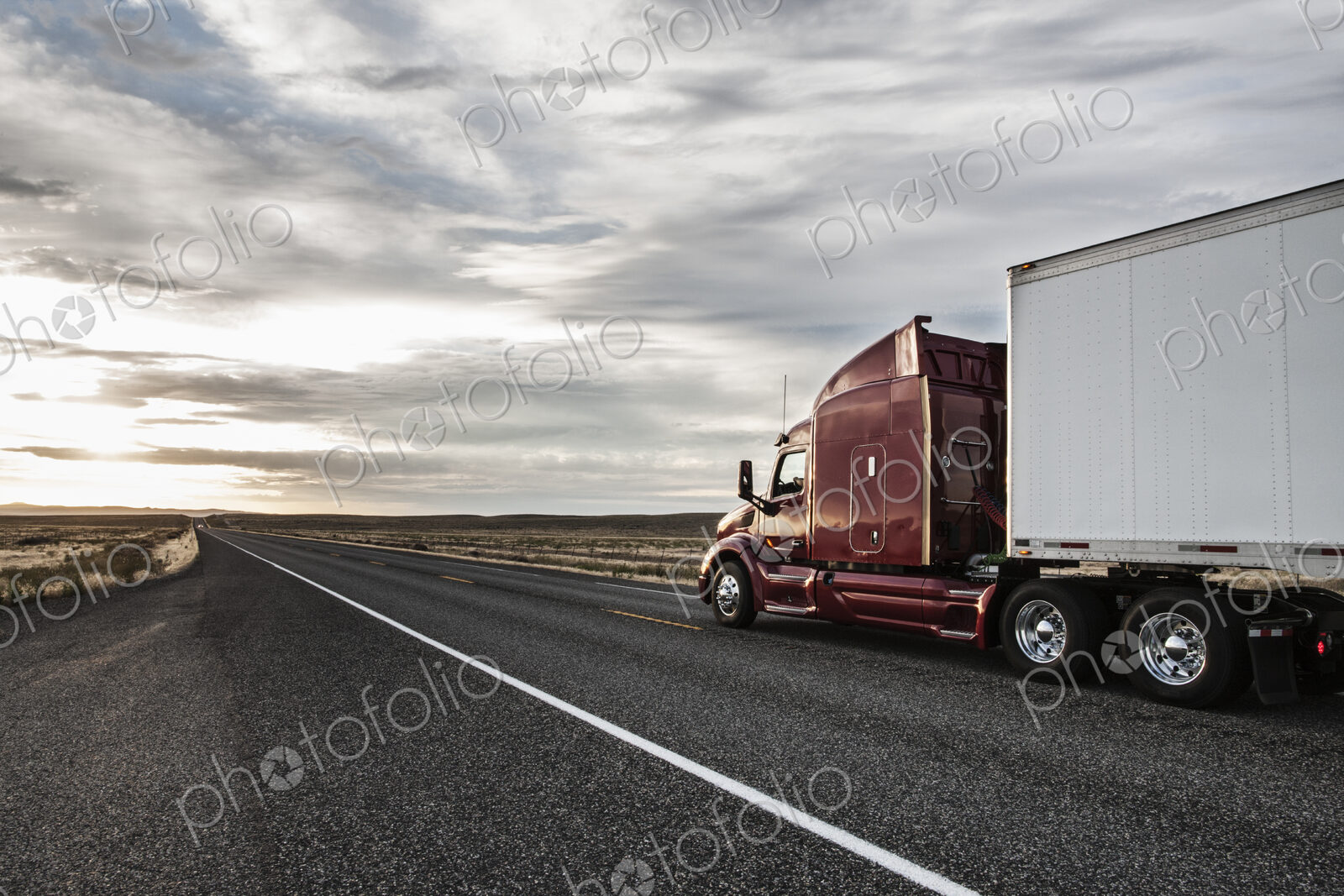 Side view of the cab of a commercial truck on the highway in eastern Washington, USA.