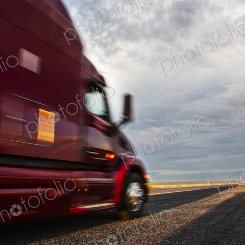 Side view of the cab of a commercial truck on the highway in eastern Washington, USA. Side view of the cab of a commercial truck on the highway in eastern Washington, USA.