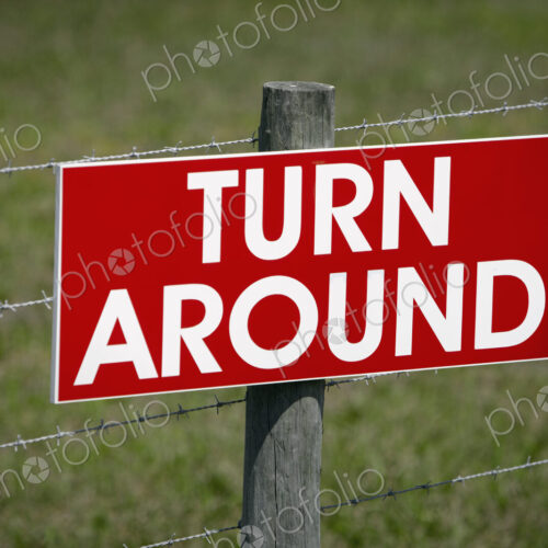 Sign on a Barbwire Fence Sign on a Barbwire Fence