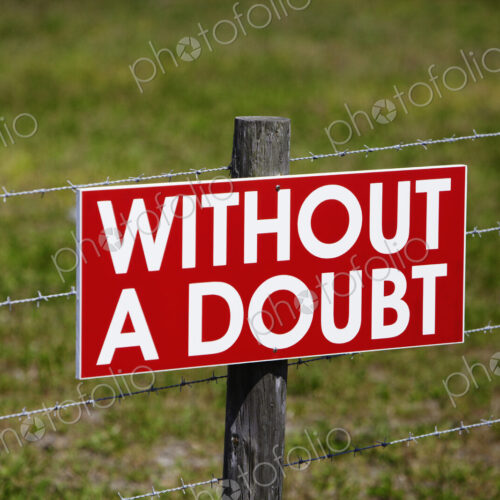 Sign on a Barbwire Fence Sign on a Barbwire Fence