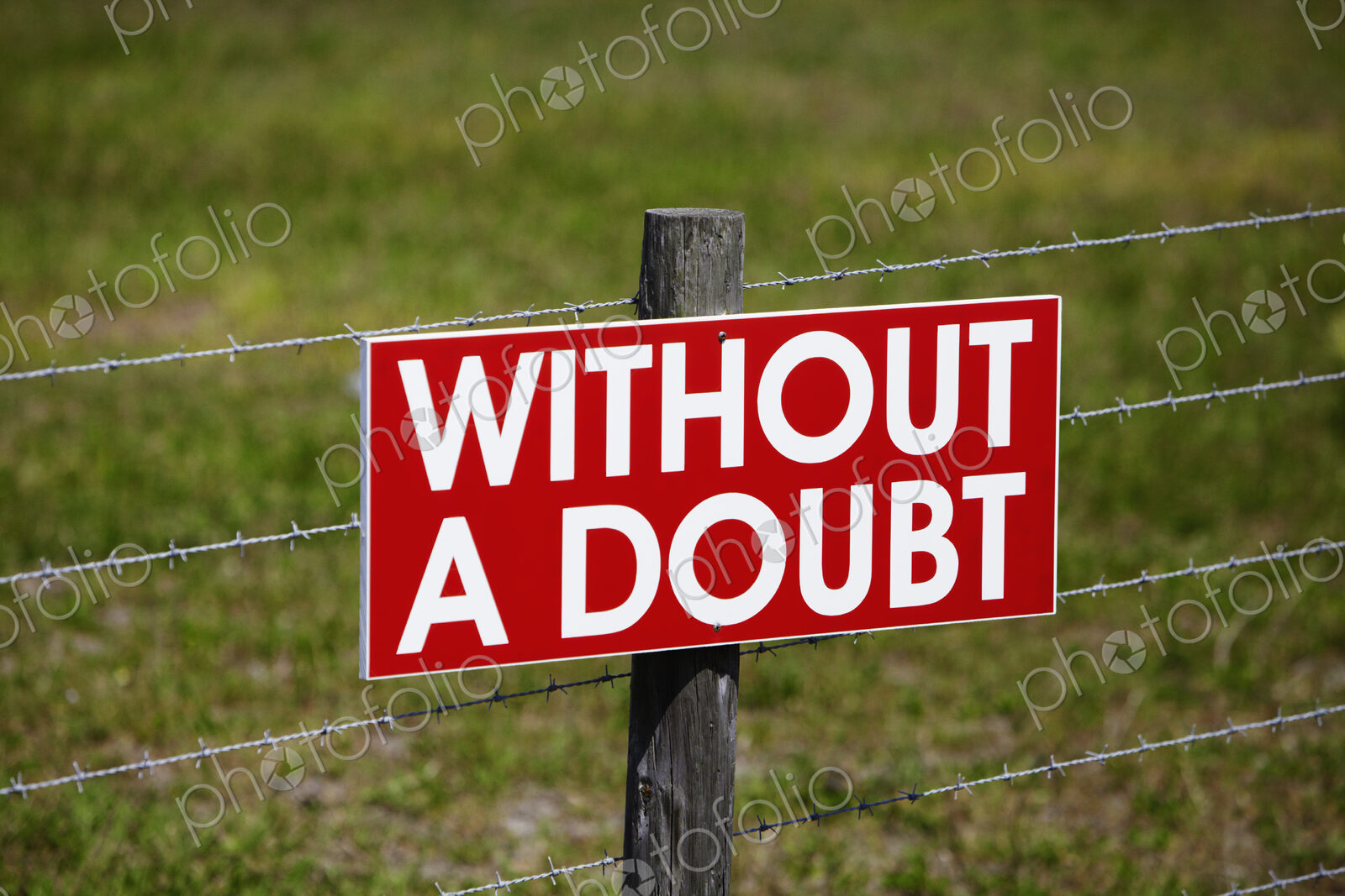 Sign on a Barbwire Fence