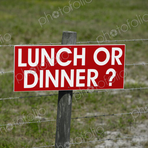 Sign on a Barbwire Fence Sign on a Barbwire Fence