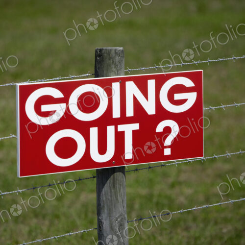Sign on a Barbwire Fence Sign on a Barbwire Fence